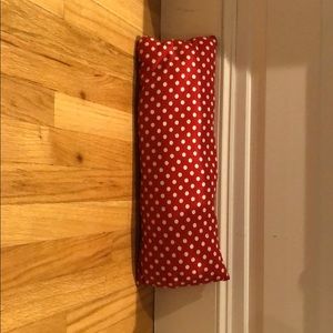 Red pillow with white dots